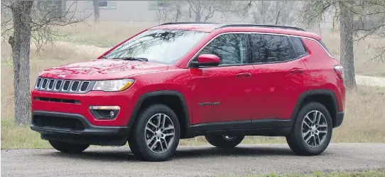  ?? COSTA MOUZOURIS/DRIVING ?? The new 2017 Jeep Compass’s exterior is more upscale than its predecesso­r’s, with styling that makes the vehicle look like a scaled-down Grand Cherokee.