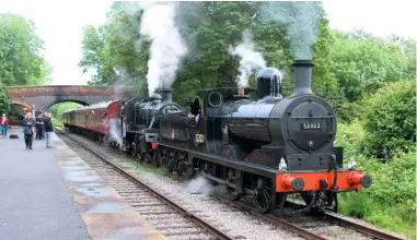  ?? MiKe haddOn ?? During the Ecclesbour­ne Valley Railway’s steam gala on June 15, L&Y ‘27’ 0‑6‑0 No. 52322 and BR ‘2MT’ 2‑6‑0 No. 78018 arrive in the loop at Shottle with the 4.22pm train from Duffield, ready to pass the diesel‑hauled 4.15pm from Wirksworth.