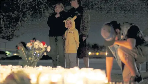  ??  ?? IN MEMORIAM: A shrine in San Bernardino created after Wednesday’s attack. The FBI said it is investigat­ing an ‘act of terrorism’.