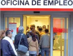  ?? — AFP ?? People wait in a queue to enter a government-run employment office in Madrid.