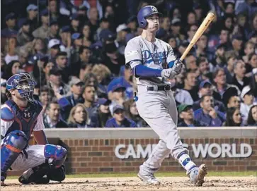  ?? Wally Skalij Los Angeles Times ?? CODY BELLINGER of the Dodgers watches his solo home run in the third inning against Jake Arrieta of the Cubs. The blast, Bellinger’s only hit in five at-bats, cut the Dodgers’ deficit to 2-1.