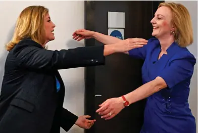  ?? ?? Friends reunited: Penny Mordaunt and Liz Truss embrace ahead of last night’s Exeter hustings