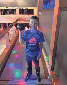  ?? COURTESY OF JESSE ELDRIDGE ?? Max Kubiak, 8, of Racine, threw 12 strikes in a row, becoming the youngest person to score a perfect 300 game in duckpin bowling at The Thirsty Duck.