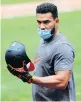  ?? JULIO CORTEZ/AP ?? Baltimore’s Anthony Santander wears a mask while getting ready to take batting practice.