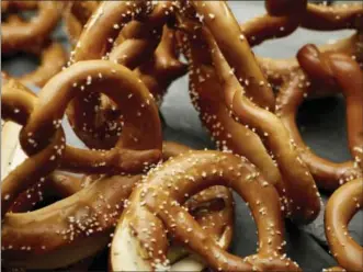  ?? PHIL MANSFIELD — THE CULINARY INSTITUTE OF AMERICA VIA AP ?? This June 26 2017 photo provided by The Culinary Institute of America shows soft pretzels in Hyde Park, N.Y. This dish is from a recipe by the CIA.