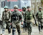  ?? IANS ?? Soldiers at the site of an encounter with terrorists in Jammu and Kashmir’s Kupwara district on 3 March, after the end of a 48-hour-long gunfight.