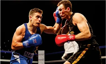  ?? Photo: CHRIS BEVAN/ENGLAND BOXING ?? KEY MOMENT: Crotty [left] clashes with Thomas Whittaker Hart