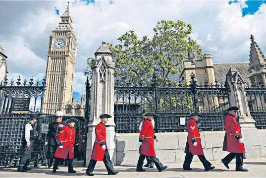  ?? ?? Below right, David Beckham said he had survived his 13-hour queue on ‘Pringles, sherbert lemons, coffee, sandwiches and doughnuts’; left, Chelsea Pensioners outside the Houses of Parliament after paying their respects; bottom, the Royal family, including Zara Tindall’s daughters Mia and Lena, at the vigil last night