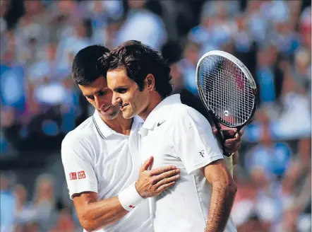  ?? Photo: GETTY ?? Greatness in defeat: Novak Djokovic, left, commiserat­es with Roger Federer after their epic Wimbledon final.