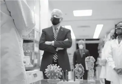  ?? EVAN VUCCI/AP ?? President Joe Biden visits the Viral Pathogenes­is Laboratory at the National Institutes of Health on Feb. 11 in Bethesda, Maryland.