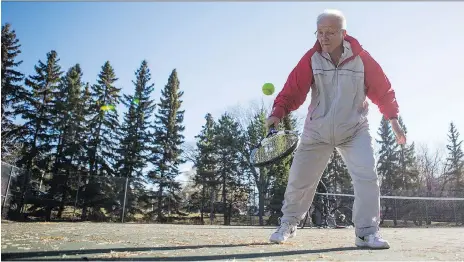  ?? KAYLE NEIS ?? Zoli Hajnal, U of S professor emeritus, brushes up on his tennis skills in the sunshine Monday at the College of Education tennis courts.