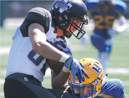  ?? MICHELLE BERG/FILES ?? Hilltops’ Cody Peters, right, was on the list of Prairie Football Conference all-stars selections.