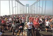  ?? AP - Richard Drew, file ?? Runners fill the upper level of the Verrazano Bridge at the start of the 2006 New York City Marathon.