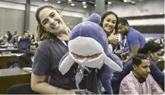  ?? ?? LUIS ACOSTA/AGENCE FRANCE-PRESSE PANAMA’S delegate Shirley Binder celebrates after the Committee I of the Convention on Internatio­nal Trade in Endangered Species of Wild Fauna and Flora summit approved proposals submitted by Panama and 15 other countries and the European Union to protect the requiem and hammerhead shark families at the Panama Convention Center.