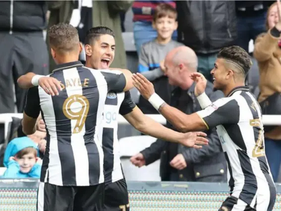  ?? (PA) ?? Perez's double and a third from Matt Ritchie keeps Newcastle top of the Championsh­ip