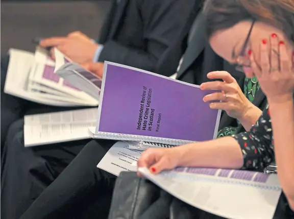  ?? PA. ?? Journalist­s read copies of Lord Bracadale’s report on his Independen­t Review of Hate Crime Legislatio­n at its publicatio­n in Edinburgh.