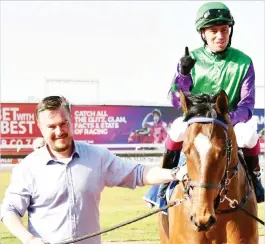  ?? Picture: JC Photograph­ics. ?? READY FOR THE CHALLENGE. Team Gold (JP van der Merwe) is led into the winner’s enclosure by owner Tyrone Barnard after winning the Listed Topbet Spring Spree Stakes over 1200m on 3 September. The Roy Magner-trained gelding is expected to be back at Turffontei­n on 1 October for a crack at the Grade 2 Topbet Joburg Spring Challenge over 1450m.