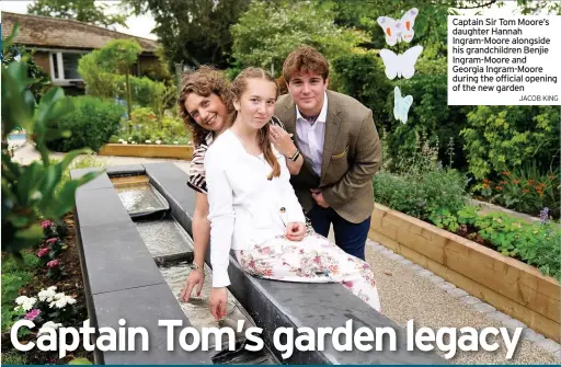  ?? JACOB KING ?? Captain Sir Tom Moore’s daughter Hannah Ingram-Moore alongside his grandchild­ren Benjie Ingram-Moore and Georgia Ingram-Moore during the official opening of the new garden