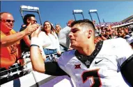  ?? TOM PENNINGTON / GETTY IMAGES ?? Oklahoma State’s Mason Rudolph threw for 28 touchdowns against only four intercepti­ons last season but lost to Oklahoma 38-20. The rematch is Nov. 4 in Stillwater.