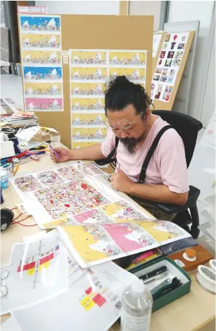  ??  ?? left, Murakami sketches and Makes correction­s on transparen­t vinyl sheets laid over printouts of his works in progress