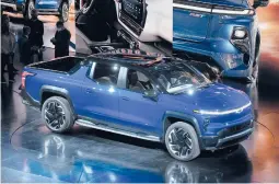  ?? PAUL SANCYA/AP ?? Intense competitio­n in the electric pickup truck market means battery-powered vehicles are going mainstream. Above, the 2024 Chevrolet Silverado EV RST.