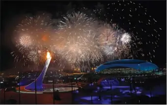  ?? The Associated Press ?? LET THE GAMES BEGIN: Fireworks are seen over the Olympic Park Friday during the opening ceremony of the 2014 Winter Olympics in Sochi, Russia.