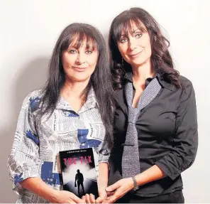  ?? ?? Arresting authors Anita Neilson (left) and Marina Clement with a copy of The Fix