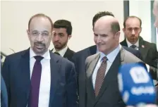  ?? — AFP ?? Saudi Arabia’s Energy Minister Khalid al Falih and Kuwait's Minister of Electricit­y and Water (R) leave Opec headquarte­rs in Vienna, Austria.