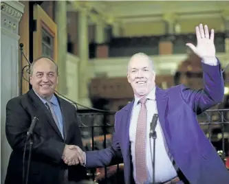  ?? CHAD HIPOLITO/THE CANADIAN PRESS ?? B.C. Green party Leader Andrew Weaver and B.C. NDP Leader John Horgan, a graduate of Trent University in Peterborou­gh, speak to media after announcing they'll be working together to help form a minority government during a press conference at...