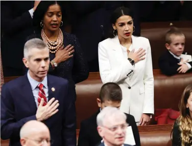  ?? CHIP SOMODEVILL­A / GETTY IMAGES ?? Democratic Rep. Alexandria Ocasio-cortez, above right, takes the oath Thursday during the first session of the 116th Congress at the U.S. Capitol. The next two years in Washington could be a wild ride, experts say.