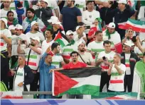  ?? GETTY IMAGES/AP ?? Proud moment: Seyam (left) celebrates his goal and fans in the stands show support