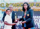  ??  ?? Chamila Heenatigal­a of NCC, the receives the Best Batsman's award from Madhuri Samuddhika, the special guest