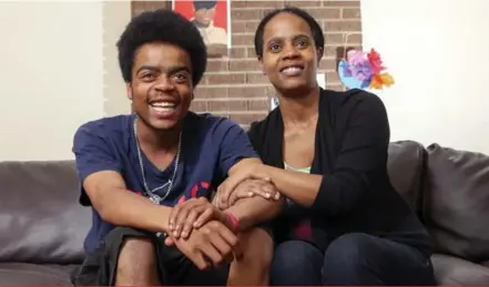  ?? ANDREW FRANCIS WALLACE/TORONTO STAR ?? “I’m overwhelme­d,” said proud mom Afifa Charles after her son Devante became the first in their family to graduate from high school.