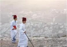  ?? — Reuters ?? Members of the Samaritan community take part in a traditiona­l pilgrimage marking the holiday of Sukkot or Feast of Tabernacle­s, atop Mount Gerizim near Nablus in the occupied West Bank on Tuesday.