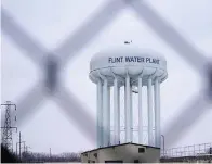  ?? The Associated Press ?? The Flint water plant tower is seen on Jan. 6 in Flint, Mich. A judge declared a mistrial Thursday after jurors said they couldn’t reach a verdict in a dispute over whether two engineerin­g firms should bear some responsibi­lity for Flint’s lead-contaminat­ed water. Four families accused Veolia North America and Lockwood, Andrews & Newman, known as LAN, of not doing enough to get Flint to treat the highly corrosive water or to urge a return to a regional water supplier.