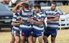  ??  ?? Brothers celebrate a Kyle Wagner (left) try at Glenholme Park on Saturday.