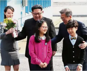  ?? — AFP ?? Bonding session: Yo-jong bringing a bouquet of flowers as Jong-un and Moon pose with children after their meeting at Panmunjom.