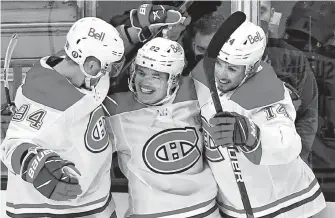  ?? USA TODAY SPORTS ?? Montreal Canadiens right winger Cole Caufield (22) celebrates with winger Corey Perry (94) and center Nick Suzuki (14) after scoring a second-period goal against the Vegas Golden Knights in Game 5 of the 2021 Stanley Cup Semifinals at T-mobile Arena in Las Vegas on Tuesday. Montreal won the game 4-1 and are one victory away from advancing to the Stanley Cup final.