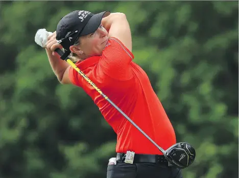  ?? VAUGHN RIDLEY/GETTY IMAGES ?? Alena Sharp of Hamilton shot a second round of 6-under 66 to tie for the lead at the LPGA Classic in Cambridge, Ont.