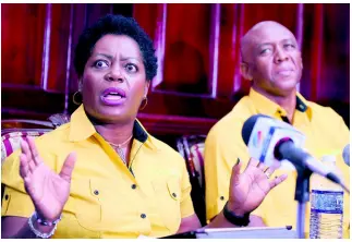  ?? CHIEF PHOTO EDITOR RICARDO MAKYN/ ?? Minett Lawrence, secretary for legal and regulatory affairs, is animated as she speaks to journalist­s at a press conference held at Caricel’s head office at Eastwood Avenue, Kingston, on Wednesday. Beside her is husband Lowell Lawrence, CEO of Caricel.