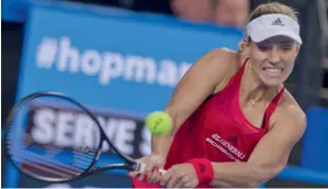  ?? AFP ?? Angelique Kerber of Germany hits a return against Elise Mertens of Belgium during their fourth session women’s singles match on day three of the Hopman Cup in Perth on Monday. —