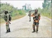  ?? PTI FILE ?? Army personnel stand guard during a gun battle with militants in Pulwama of South Kashmir.