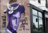  ?? JIM MONE — THE ASSOCIATED PRESS FILE ?? A mural honoring the late Prince adorns a building in the Uptown area of Minneapoli­s.