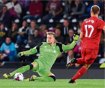  ?? — Reuters ?? Back in the game: Loris Karius (left) was widely expected to become Liverpool’s first-choice goalkeeper when he signed from Mainz but his progress was halted when he suffered a broken finger during a pre-season tour.