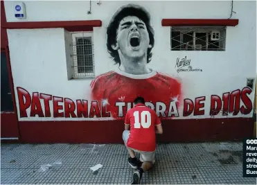  ?? ?? GODLIKE: Maradona is revered as a deity in the streets of Buenos Aires