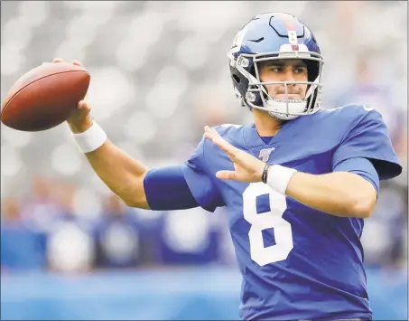  ?? Adam Hunger / Associated Press ?? New York Giants quarterbac­k Daniel Jones warms up before a game against the Minnesota Vikings on Sunday in East Rutherford, N.J. The Giants lost 2810, but Jones continues to be a bright spot.