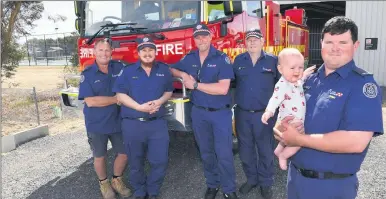  ?? Picture: PAUL CARRACHER ?? SEASON READY: Horsham group officer Roger Perris, left, and Vectis Fire Brigade members Ambrose Hose, Michael Bouma, Len Hawker with captain Jesse Raggatt and six-month old son Dallas, prepare for the 2023-24 fire season.