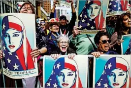  ?? EDUARDO MUNOZ ALVAREZ/GETTY ?? People participat­e Sunday in a New York City rally in support of U.S. Muslims.