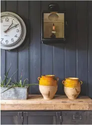  ??  ?? Dining area
A row of French confit pots on the 1930s cabinet, paired with a 1950s French factory clock, brings plenty of character to this space. Vintage steel cabinet, Original House