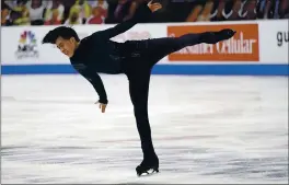  ?? JOHN LOCHER — THE ASSOCIATED PRESS ?? Vincent Zhou of Palo Alto competes en route to a career-best 107.70 points in the short program at the U.S. Figure Skating Championsh­ips. Zhou trailed only Nathan Chen.